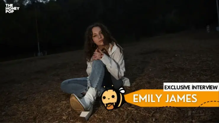 Emily James sits on the ground. Graphic showing that the article contains an interview.